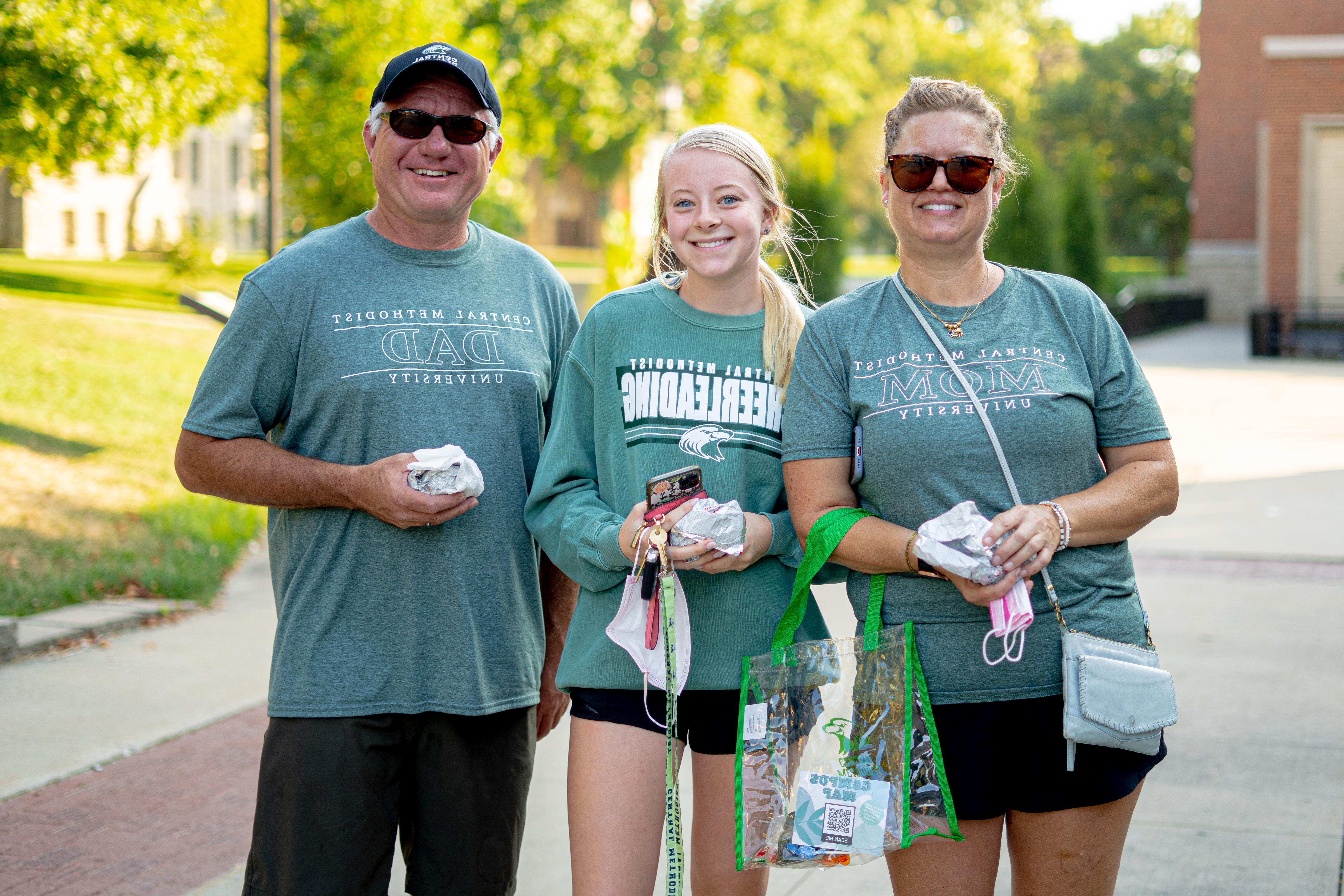 Student and parents on campus